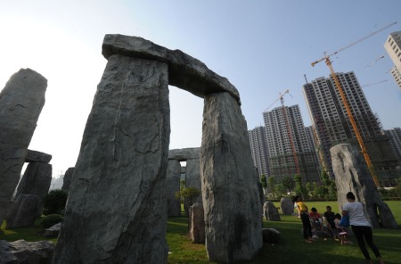 Hefei Stonehenge with high rise backdrop (STR/AFP/GettyImages)